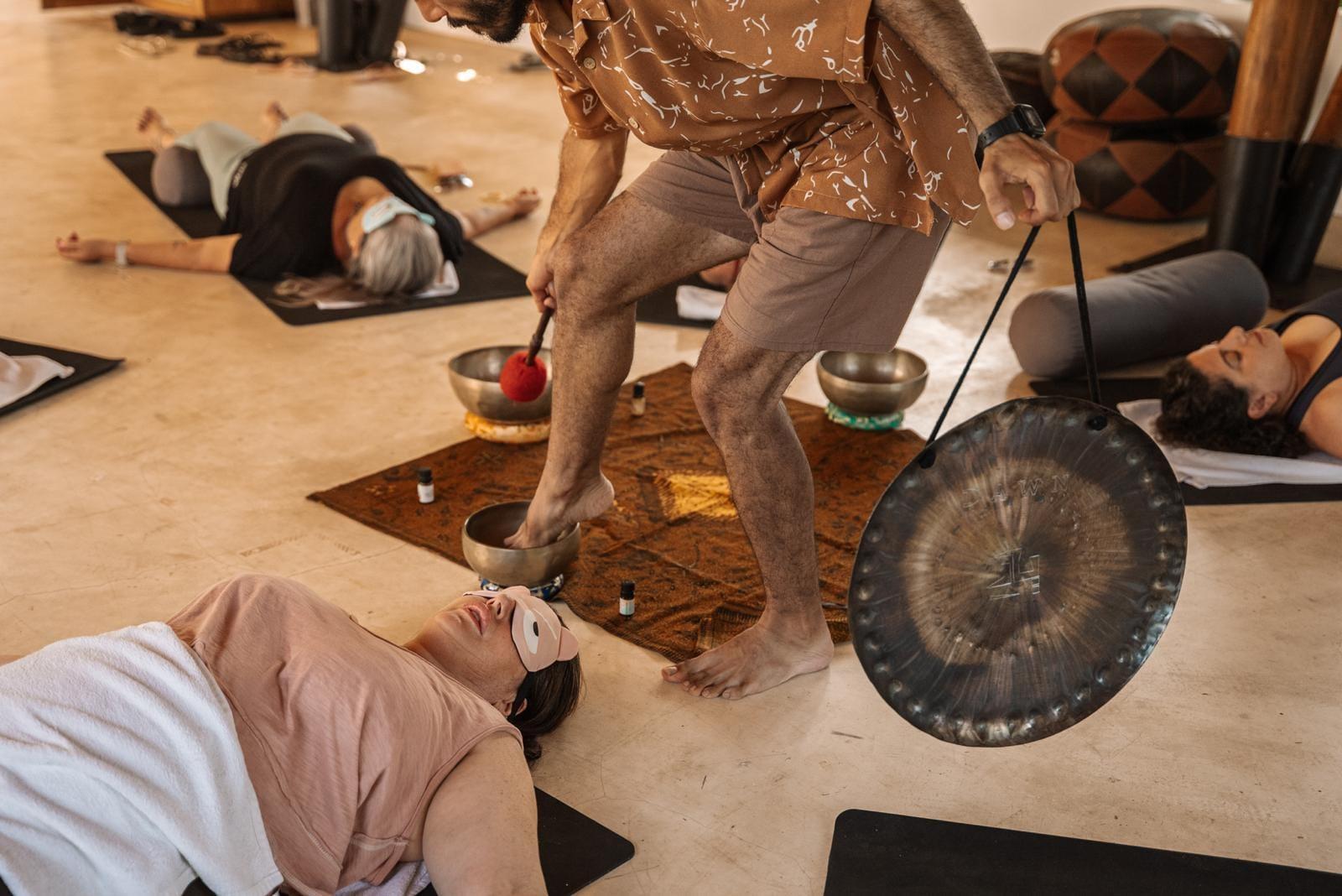 A sound bath in the shala - the gong sounding over the group lying on their mats